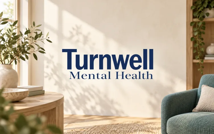 Turnwell Mental Health lettering in a warm, softly lit conceptual care setting